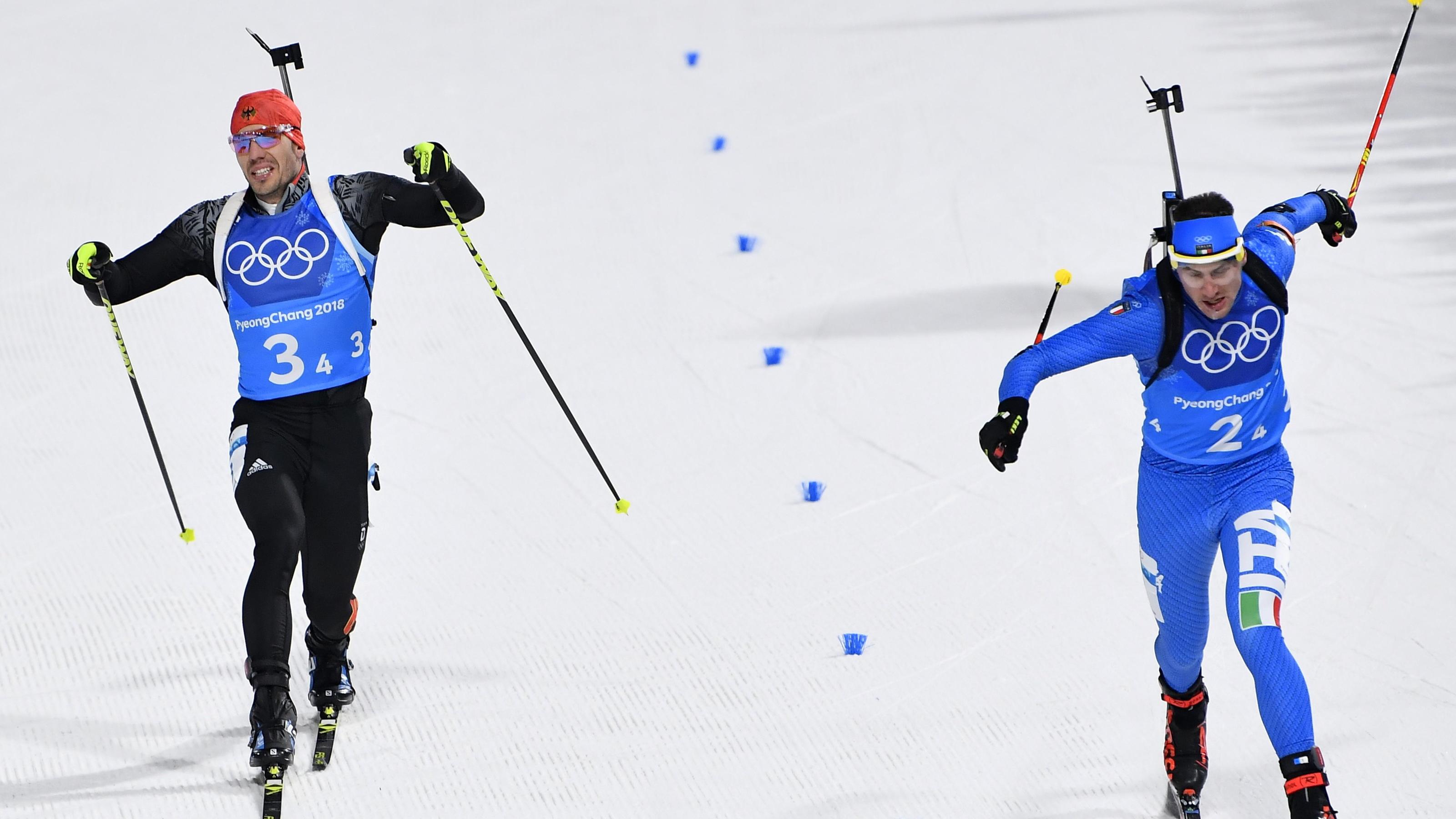 Biathlon: Kein Edelmetall in der Mixed-Staffel - Peiffer verballert sicher geglaubte Medaille Biathlon - Pyeongchang 2018 Winter Olympics - Mixed Relay Final - Alpensia Biathlon Centre - Pyeongchang, South Korea - February 20, 2018 - Arnd Peiffer of Germany and Dominik Windisch of Italy finish. REUTERS/Toby Melville