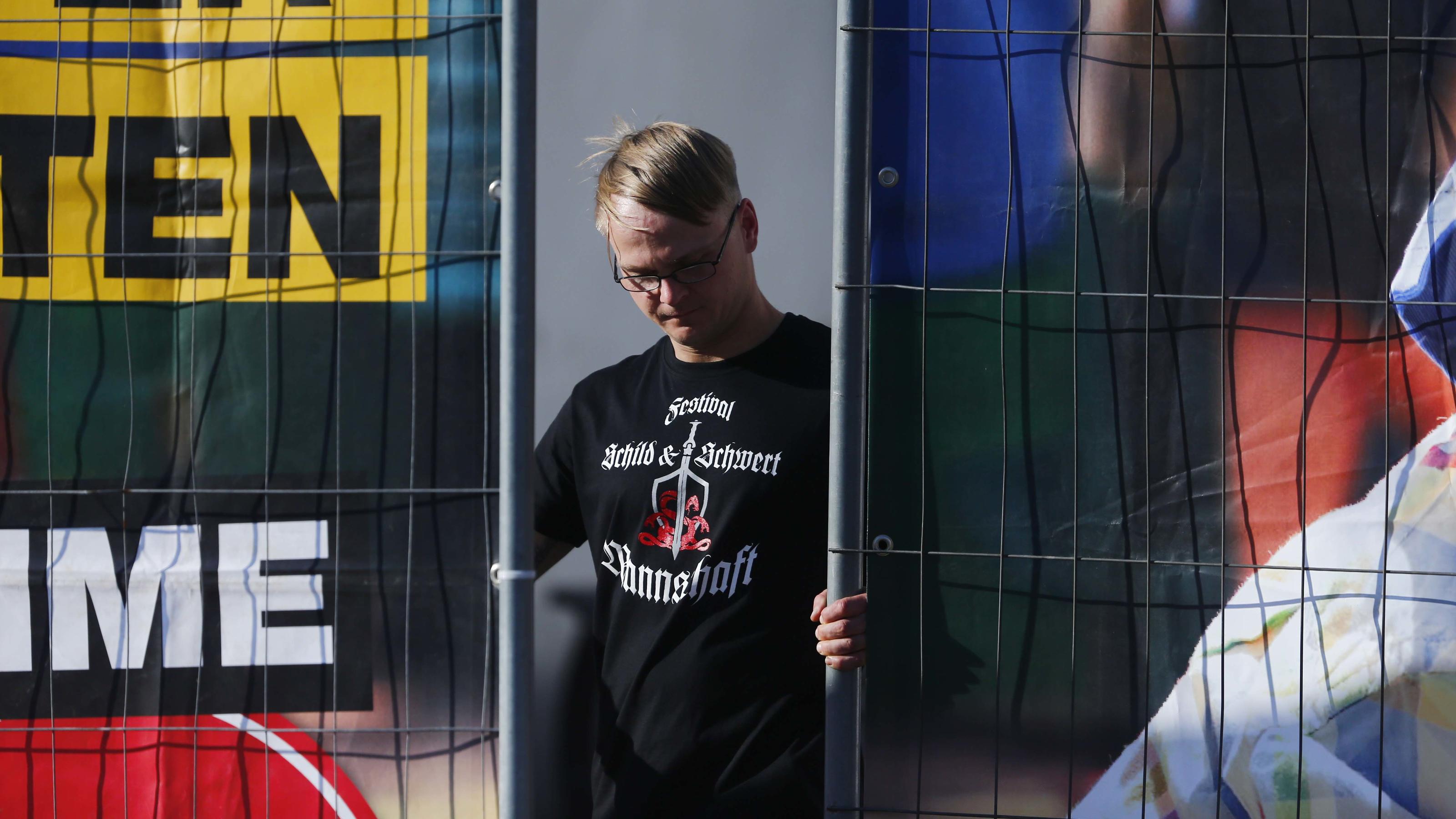 Gegenveranstaltung zu Neonazi-Festival in Ostritz: Tausende bilden Menschenkette und feiern 'Friedensfest' Far-right supporter attends rock music festival "Schwert und Schild" (Sword and Shield) in Ostritz, Germany April 20, 2018. REUTERS/Hannibal Hanschke